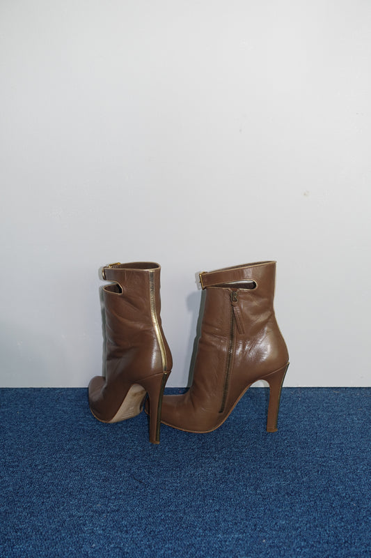 Miu Miu ankle boots with gold trim
