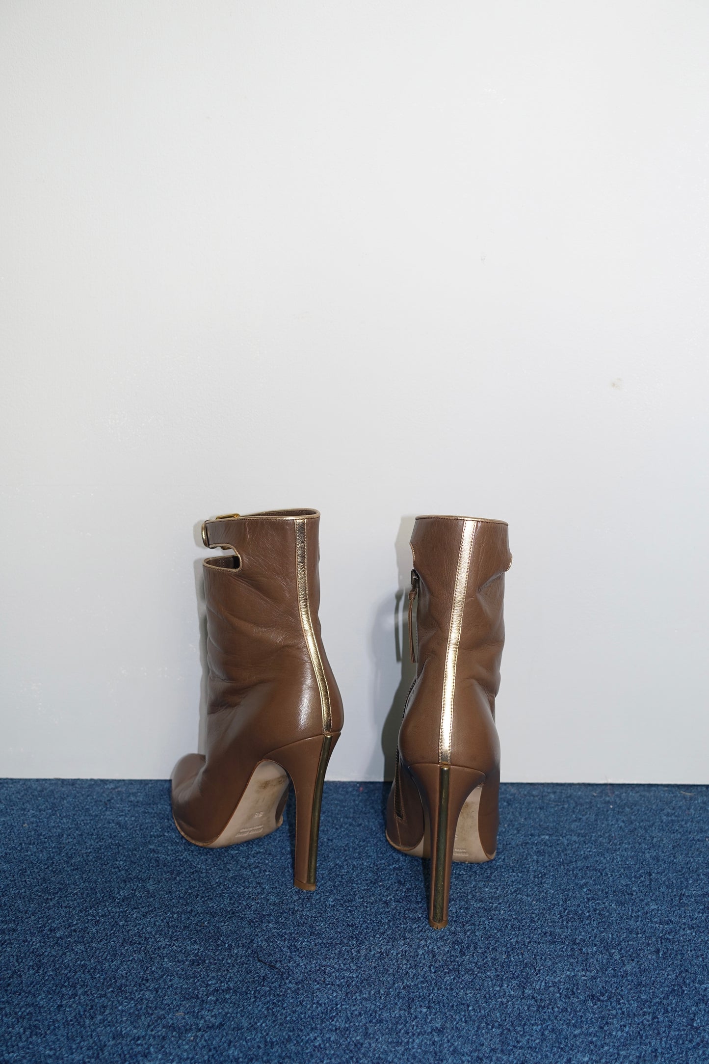 Miu Miu ankle boots with gold trim