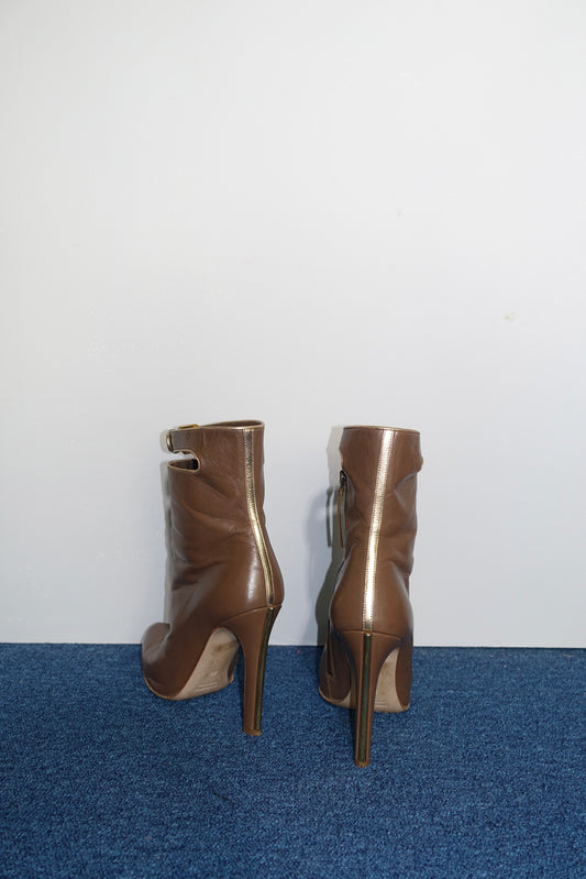 Miu Miu ankle boots with gold trim